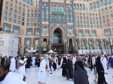 A beautiful daytime view of the Mecca Clock Tower in front of the Grand Mosque in Mecca, Saudi Arabia.