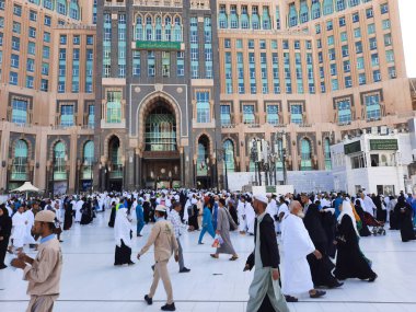 A beautiful daytime view of the Mecca Clock Tower in front of the Grand Mosque in Mecca, Saudi Arabia.