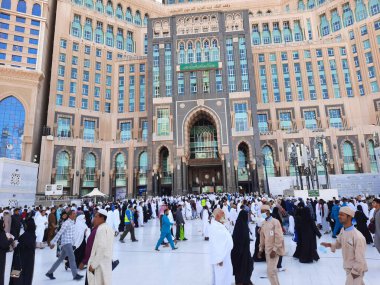 A beautiful daytime view of the Mecca Clock Tower in front of the Grand Mosque in Mecca, Saudi Arabia.