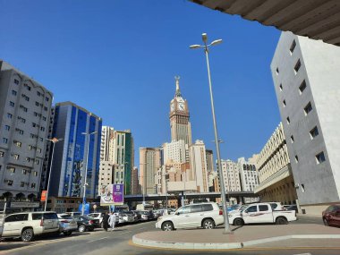 A beautiful daytime view of the Mecca Clock Tower in front of the Grand Mosque in Mecca, Saudi Arabia.