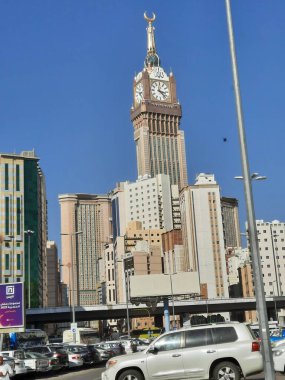 A beautiful daytime view of the Mecca Clock Tower in front of the Grand Mosque in Mecca, Saudi Arabia.