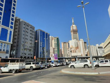 A beautiful daytime view of the Mecca Clock Tower in front of the Grand Mosque in Mecca, Saudi Arabia.