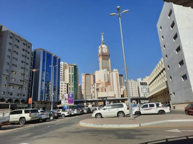 A beautiful daytime view of the Mecca Clock Tower in front of the Grand Mosque in Mecca, Saudi Arabia.