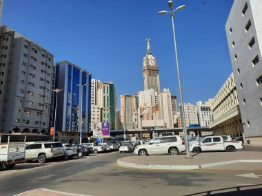 A beautiful daytime view of the Mecca Clock Tower in front of the Grand Mosque in Mecca, Saudi Arabia.