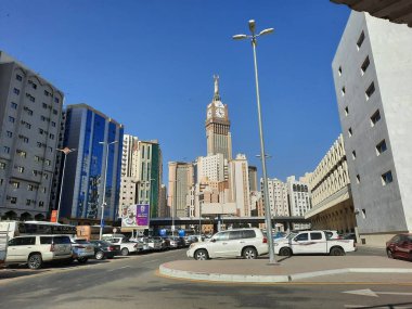 A beautiful daytime view of the Mecca Clock Tower in front of the Grand Mosque in Mecca, Saudi Arabia.