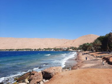 The mesmerizing view of the deep blue waters of Haql beach in Saudi Arabia. Haql Beach in Saudi Arabia is famous for its deep blue water and natural beauty.