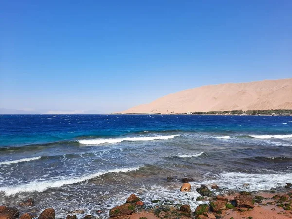 The mesmerizing view of the deep blue waters of Haql beach in Saudi Arabia. Haql Beach in Saudi Arabia is famous for its deep blue water and natural beauty.