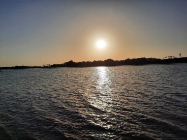 Beautiful evening and colorful sunset at Jeddah, Corniche, Saudi Arabia, The Jeddah Corniche, also known as the Jeddah Waterfront, is a coastal area of the city of Jeddah, Saudi Arabia. Located along the Red Sea.