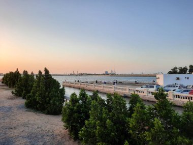 Beautiful evening and colorful sunset at Jeddah, Corniche, Saudi Arabia, The Jeddah Corniche, also known as the Jeddah Waterfront, is a coastal area of the city of Jeddah, Saudi Arabia. Located along the Red Sea.