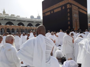 Pilgrims from all over the world are present in the courtyard of Masjid al-Haram for Tawaf. clipart