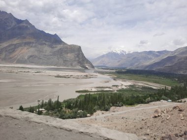 The breathtaking natural beauty of the Shigar Valley in Gilgit-Baltistan, Pakistan. The Shigar Valley is famous for its high mountains and natural beauty. clipart