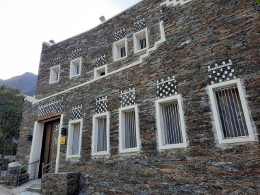 Stunning daytime perspective of the historic structures at Rijal  Almaa Archaeology in Asir. The Historical Significance of Rijal  Almaa is not just a collection of old buildings; it represents a vital part of the cultural heritage of the Asir.  clipart