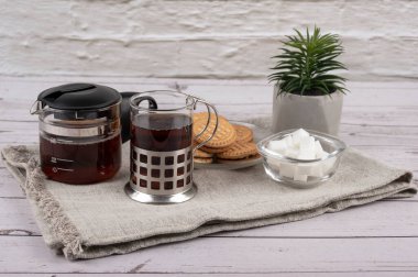 Morning tea and cookies on the table in the kitchen 