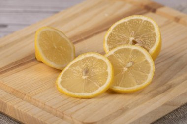 Lemon slices lie on the table in the kitchen 