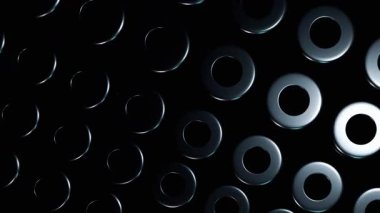 Görüntü, koyu renkli metal küplerin soyut bir bileşimini gösteriyor. Işık ve gölgenin etkileşimi üç boyutlu dokuyu geliştirir..