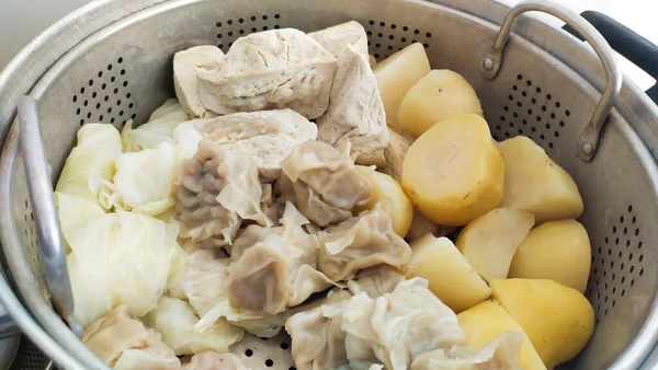 stock image Indonesian street food 'Baso Tahu' which consists of steamed dumplings, potatoes and tofu in a steamer