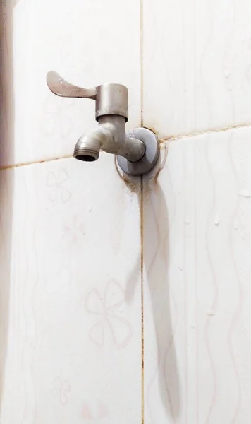 stock image The water faucet on the bathroom wall is closed, does not drain water