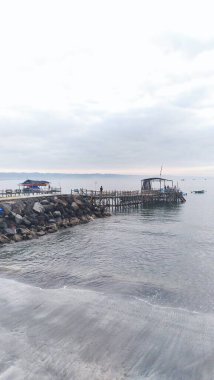 Pangandaran, Indonesia - December 22nd 2023: The view of Pangandaran beach is calming, still quiet and not many visitors