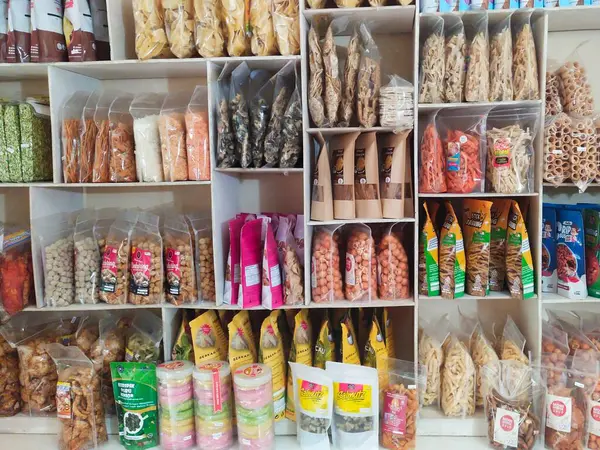 stock image Cianjur, Indonesia - May 8 2024; display racks for various home-produced snack products typical of the city of Cianjur, Indonesia in a souvenir shop