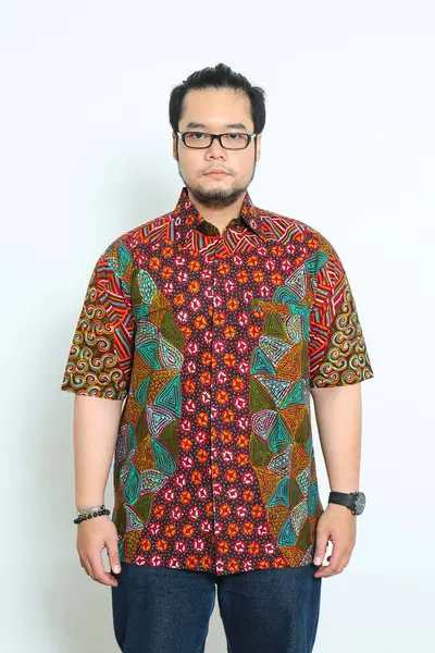 stock image A man wearing a typical Indonesian Batik shirt with beautiful colors and motifs