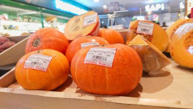 Bandung, Indonesia - December 1st 2024; fresh Pumpkin fruits sold in supermarkets at the price and weight listed clipart