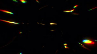 Düşen Altın Konfeti, yumuşak odaklı gökkuşağı renkli ışık huzmeleri. Siyah arkaplanda soyut spektrum ışınları. 4K 3D çevrimli canlandırma.