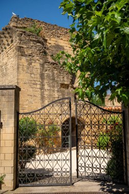 VIew on medieval buildings in sunny day, vacation destination, famous wine making village Chateauneuf-du-pape in Provence, France