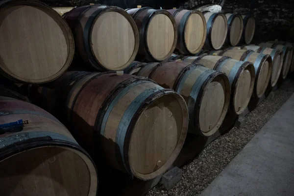 Stages of wine production from fermentation to bottling, visit to wine cellars in Cote d'Or, Burgundy, France, Aging in wooden barrels.