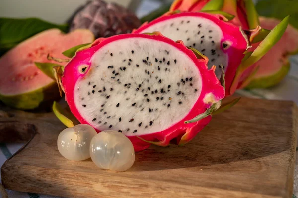 stock image Colorful ripe dragon fruit and peeled lychees, tasty tropical exotic fruits close up