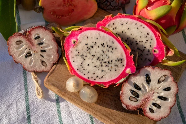 stock image Variaty of tasty tropical exotic fruits, ripe fresh lychee, dragon fruit, guava and cherimoya