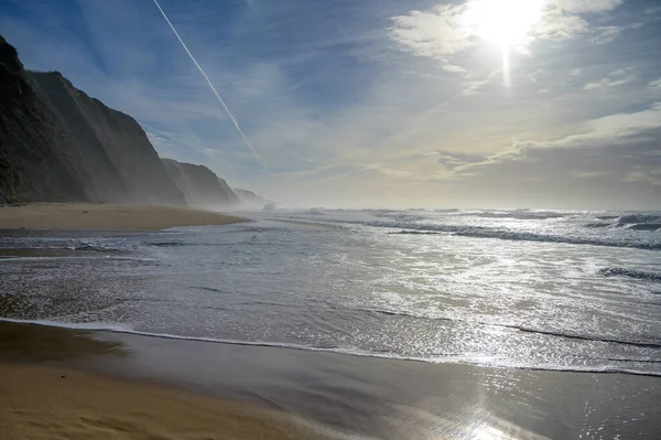 stock image Magoito Beach on Atlantic ocean at sunset, beautiful sandy beach on Sintra coast, Lisbon district, Portugal, part of Sintra-Cascais Natural Park with natural points of interest