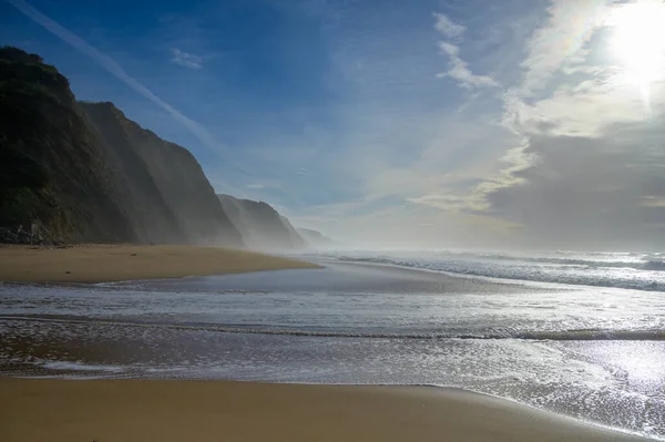 stock image Magoito Beach on Atlantic ocean at sunset, beautiful sandy beach on Sintra coast, Lisbon district, Portugal, part of Sintra-Cascais Natural Park with natural points of interest