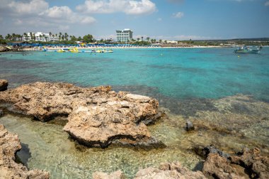 View on seashore with blue crystal clear water on Mediterranean sea near Nissi Beach, Ayia Napa, Cyprus summer sea vacation