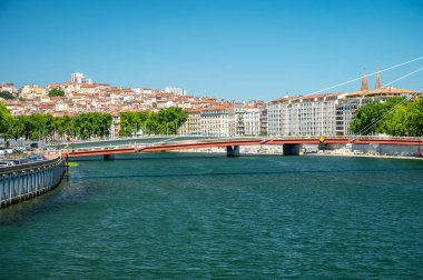 Tourists destination, views of Rhone river, streets, houses, cafes in old central part of Lyon in summer, France