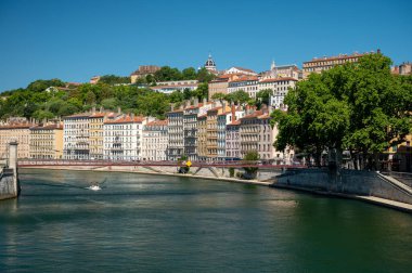 Tourists destination, views of Rhone river, streets, houses, cafes in old central part of Lyon in summer, France