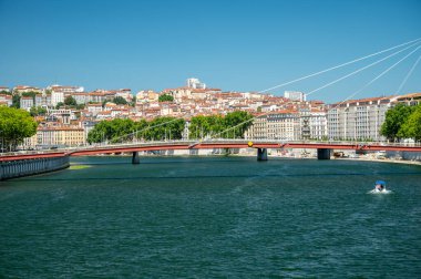 Tourists destination, views of Rhone river, streets, houses, cafes in old central part of Lyon in summer, France