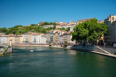 Tourists destination, views of Rhone river, streets, houses, cafes in old central part of Lyon in summer, France