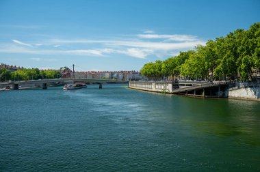 Tourists destination, views of Rhone river, streets, houses, cafes in old central part of Lyon in summer, France