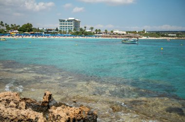 View on seashore with blue crystal clear water on Mediterranean sea near Nissi Beach, Ayia Napa, Cyprus summer sea vacation