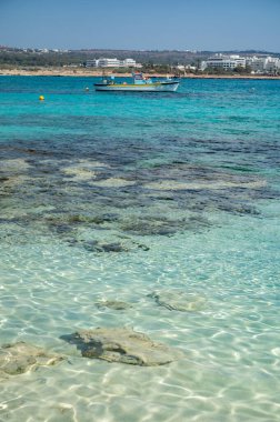 View on seashore with blue crystal clear water on Mediterranean sea near Nissi Beach, Ayia Napa, Cyprus summer sea vacation
