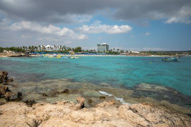 View on seashore with blue crystal clear water on Mediterranean sea near Nissi Beach, Ayia Napa, Cyprus summer sea vacation