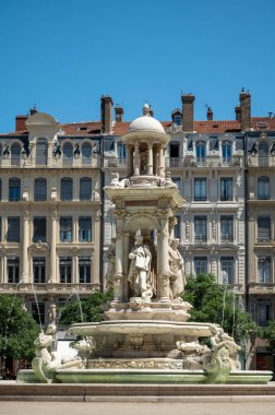 Tourist destination, views of fontain, houses in old central part of Lyon in summer, France