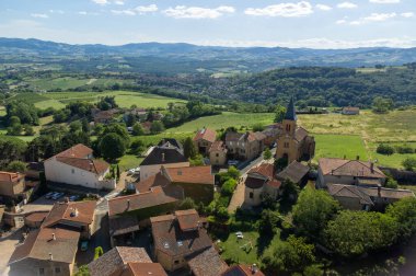 Wine making region Beaujolais Pierre dorees wioth yellow houses and hilly vineyards, aerial view, France in summer