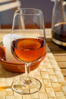 Tasting of sweet moscatel de setubal or white porto portuguese wine close up