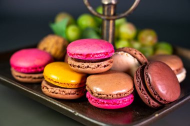 Macarons or French macaroon  sweet meringue-based confection made with egg white, icing sugar, granulated sugar, almond meal, and food colouring, sweet french dessert