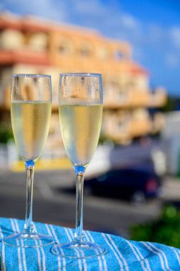 Dinner party, drinking of cava or champagne sparkling wine in vacation resort Caleta Fuste, Fuerteventura, Canary islands winter sun vacation, Spain
