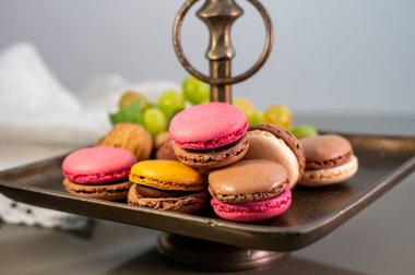 Macarons or French macaroon  sweet meringue-based confection made with egg white, icing sugar, granulated sugar, almond meal, and food colouring, sweet french dessert
