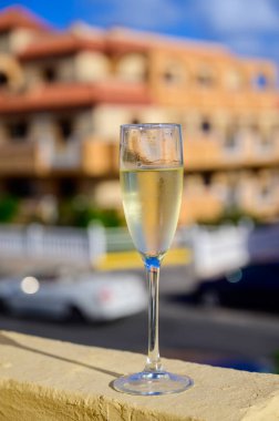 Dinner party, drinking of cava or champagne sparkling wine in vacation resort Caleta Fuste, Fuerteventura, Canary islands winter sun vacation, Spain