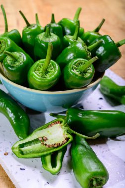Fresh green mild padron pepper pementos, ready for grill or to b