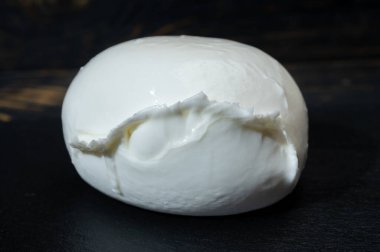 Tasting of txakoli or chacoli slightly sparkling very dry white wine produced in Spanish Basque Country with view on old port and sunny village Getaria, Spain